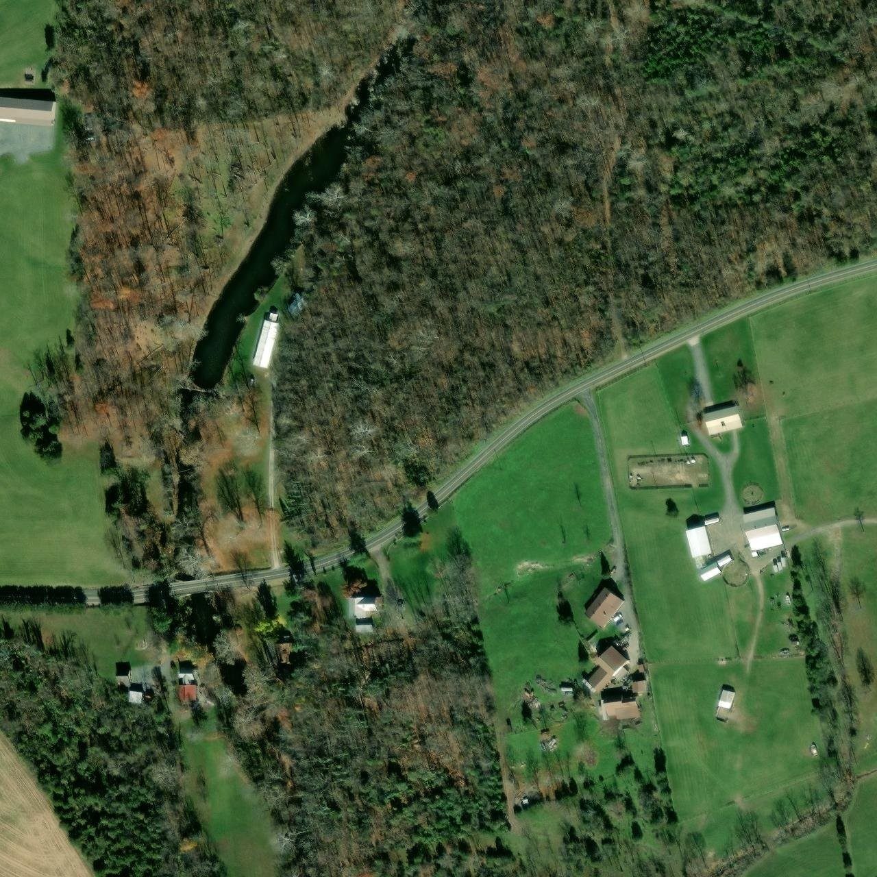 Aerial view of the Kump's Dam pond and park building